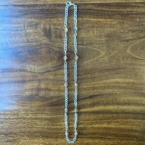 Wire wrapped silver colored chain necklace with light peach/orange 6 mm beads